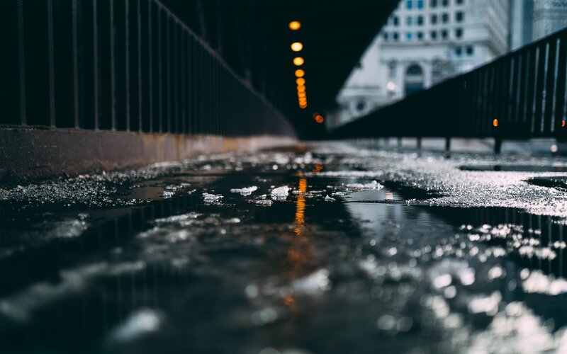 Puddle with Ice under Bridge