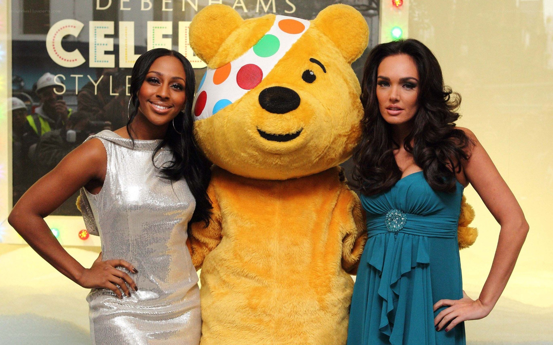 Pudsey Bear with two women