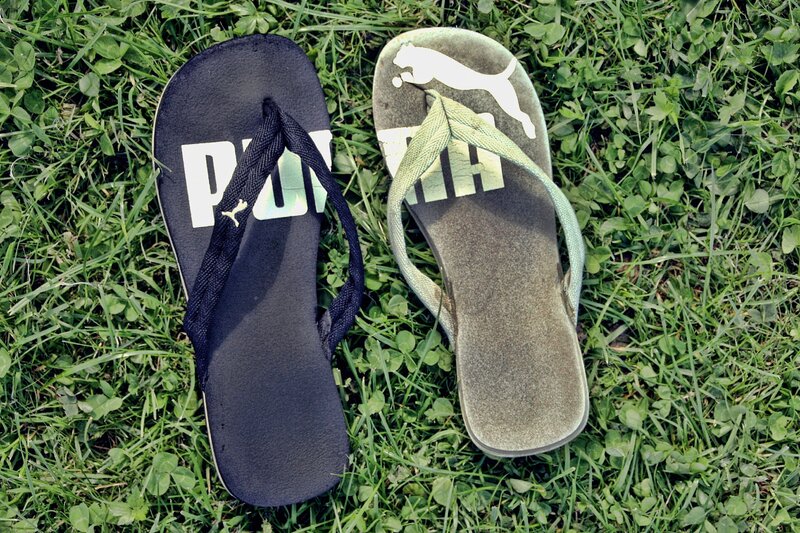 Puma flip-flops on grass