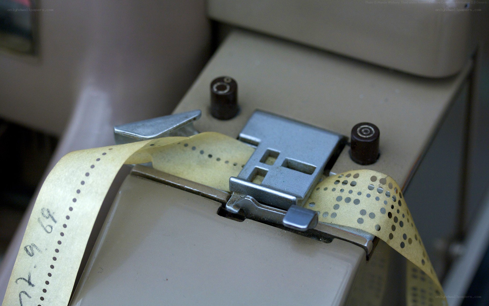 Punched paper tape in a reader