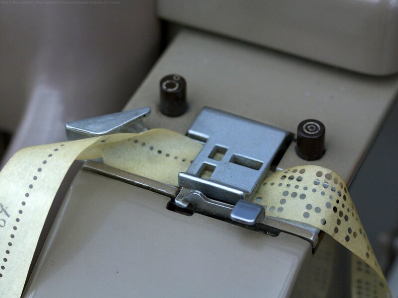 Punched paper tape in a reader