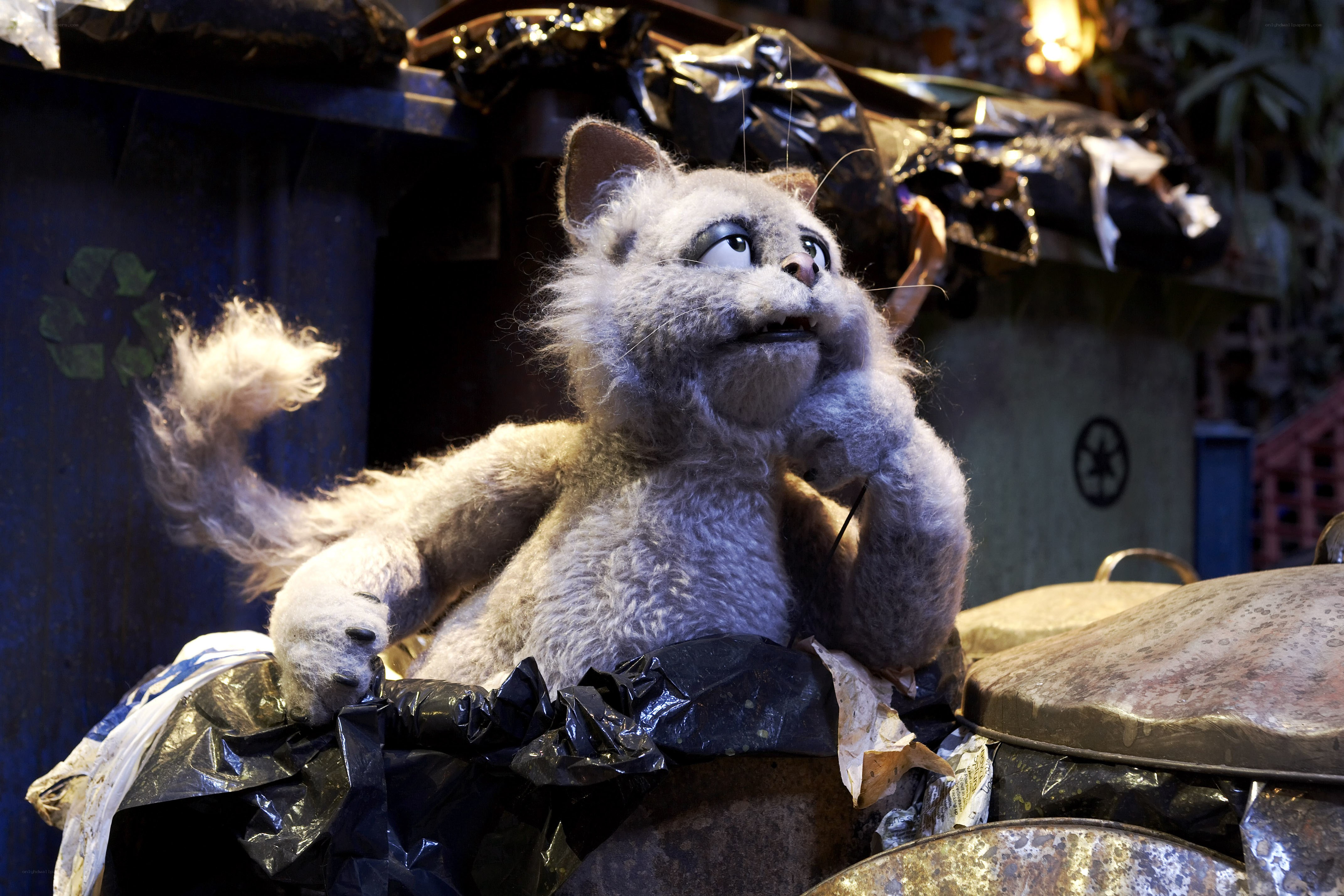 Puppet cat in trash bin