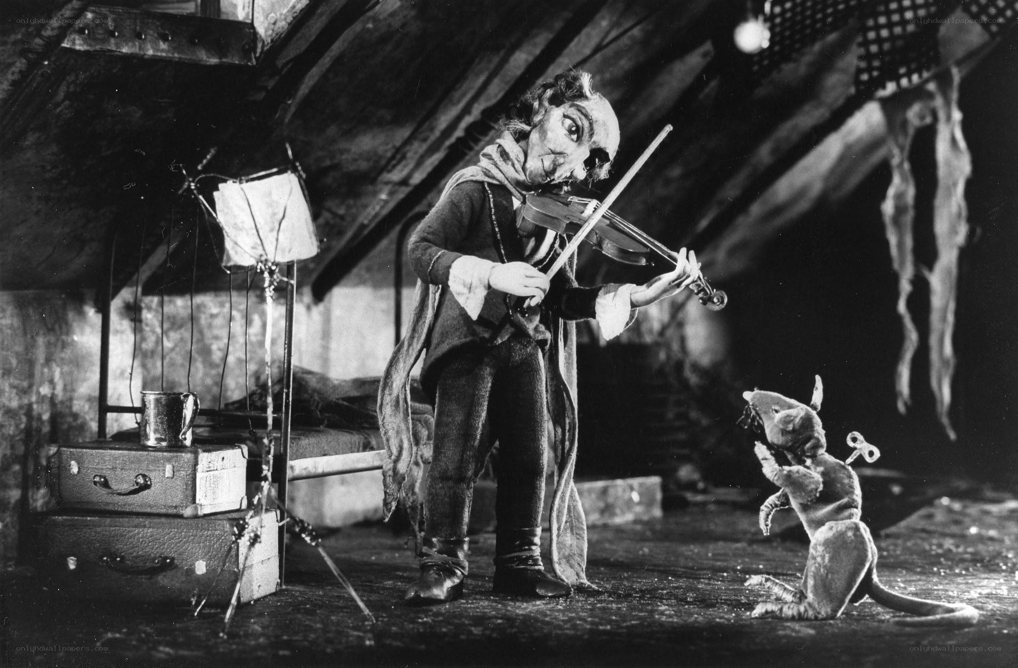 Puppet playing violin for mouse