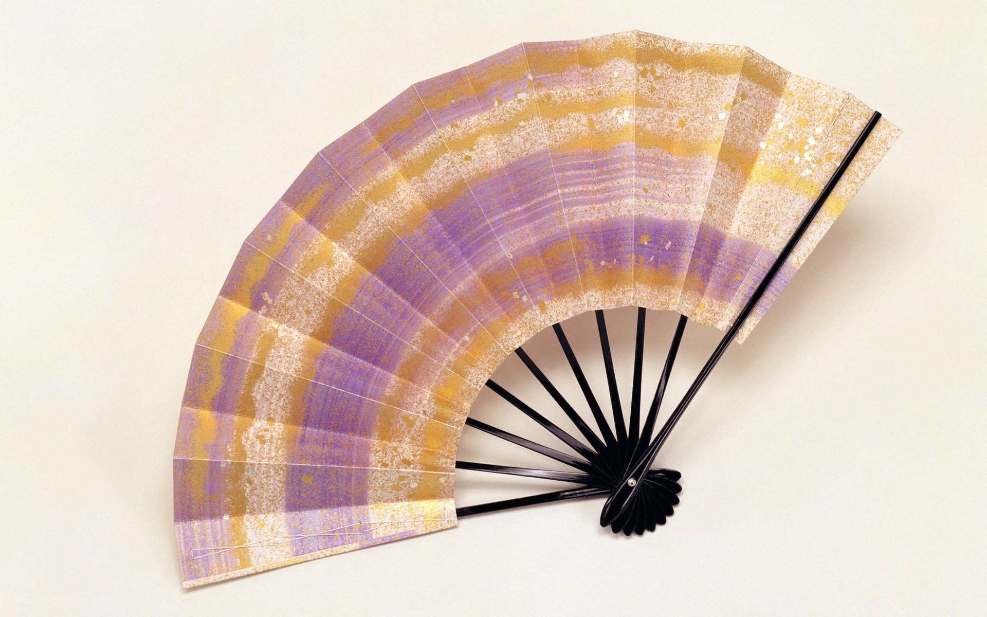 Purple and gold folding fan