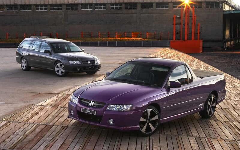 Purple and gray Holden utility cars
