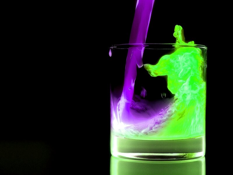 purple and green liquid pouring
