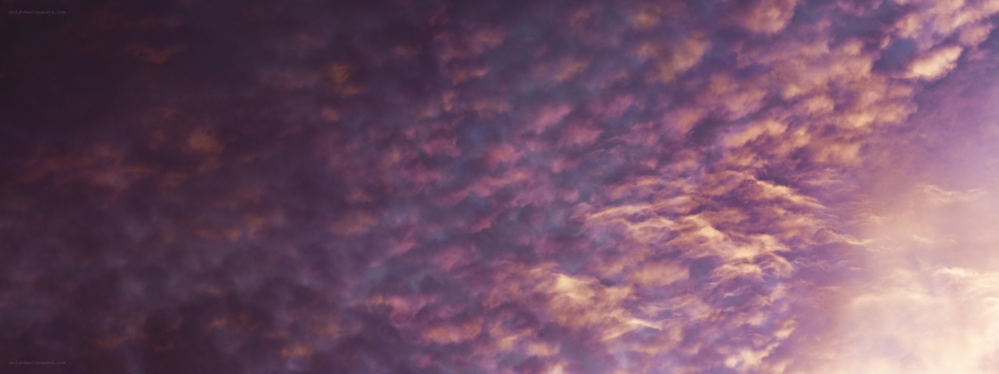 purple and orange clouds at sunset