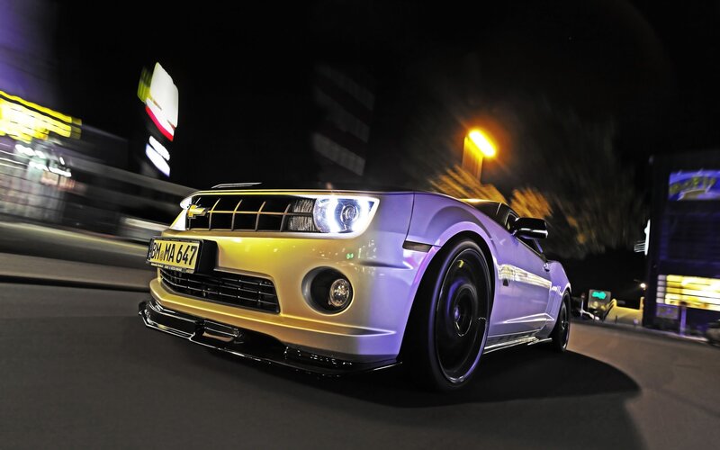 purple and yellow car at night