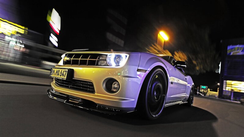 purple and yellow car at night