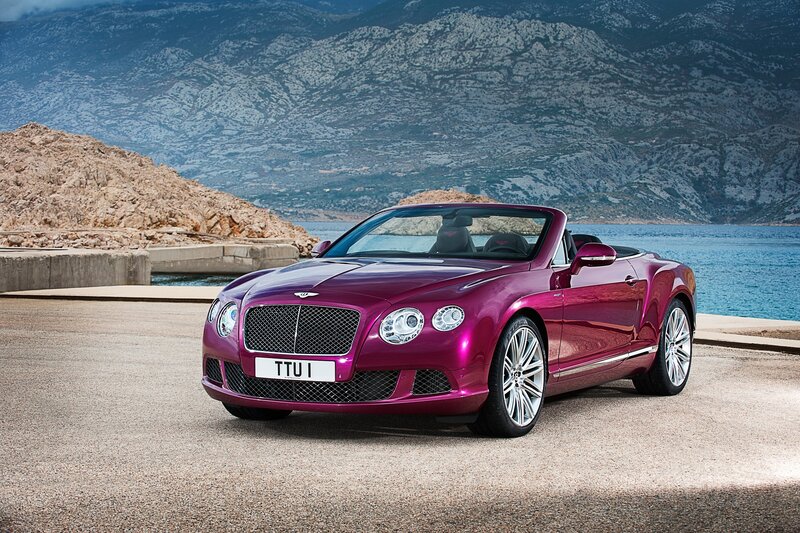 Purple Bentley convertible by the sea