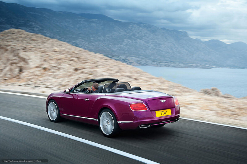 Purple Bentley convertible on coastal road