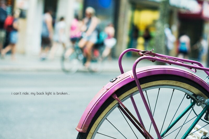 purple bike on city street
