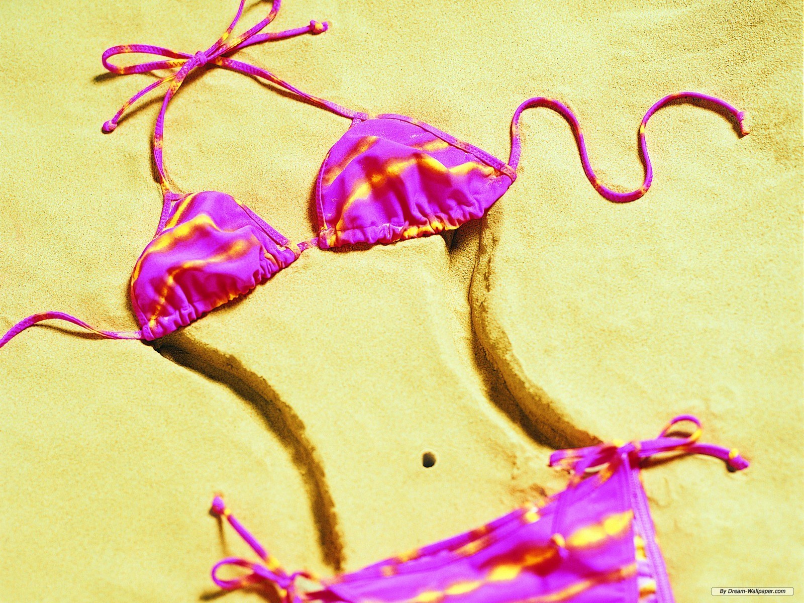 purple bikini on sand