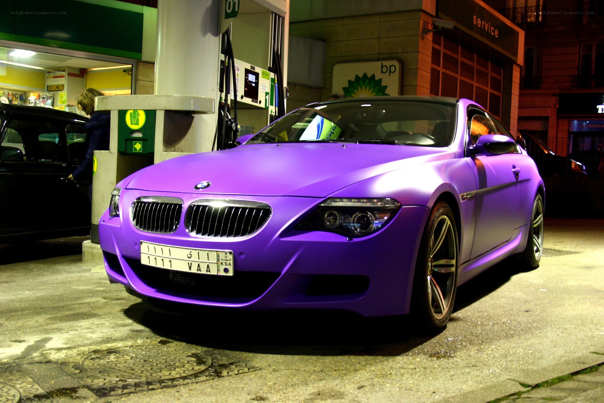 purple bmw at gas station