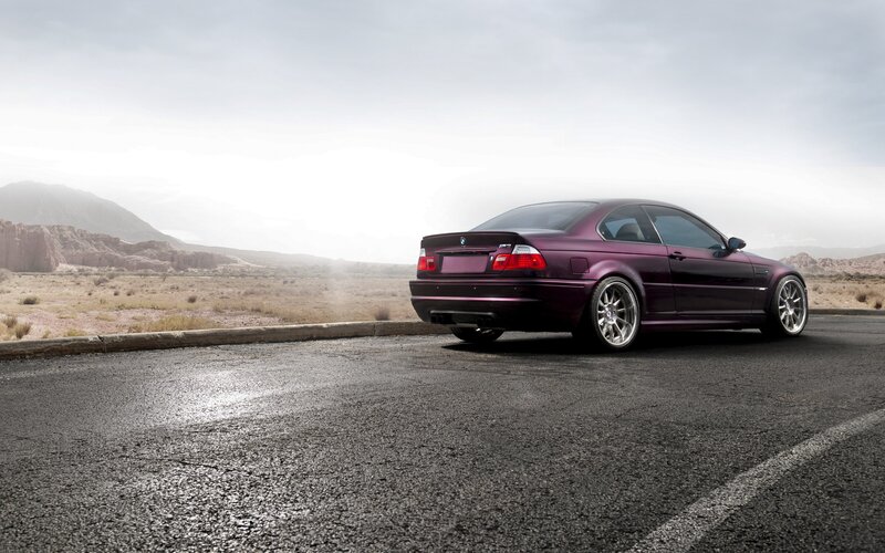 Purple BMW in desert landscape