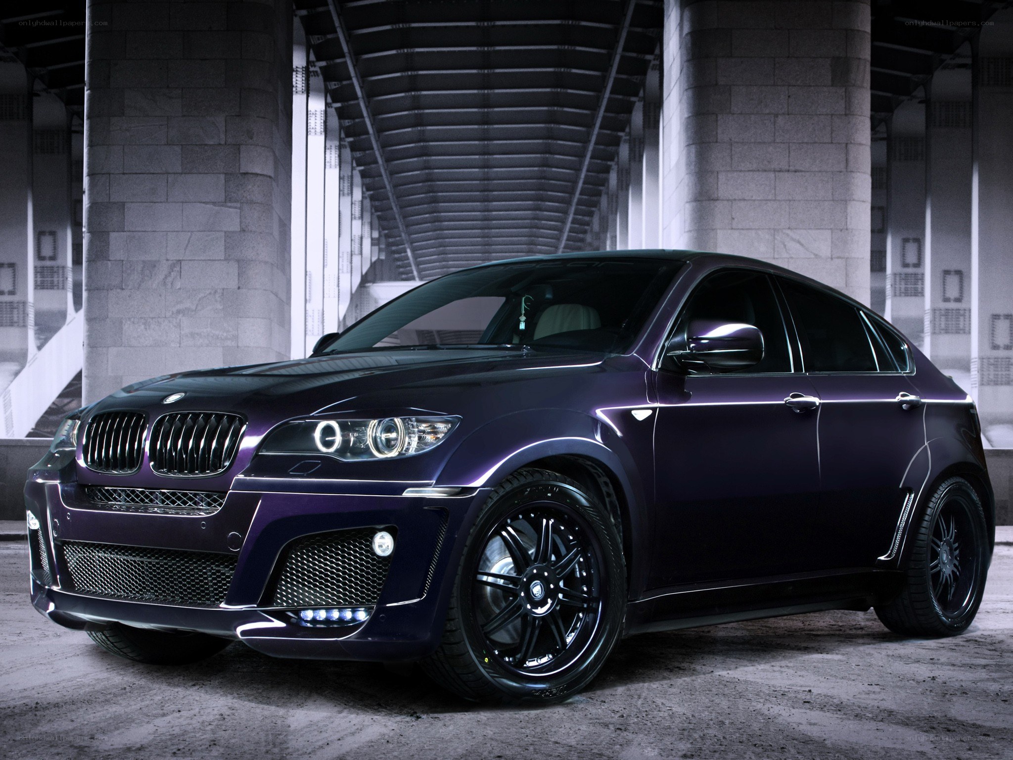 Purple BMW X6 in urban setting