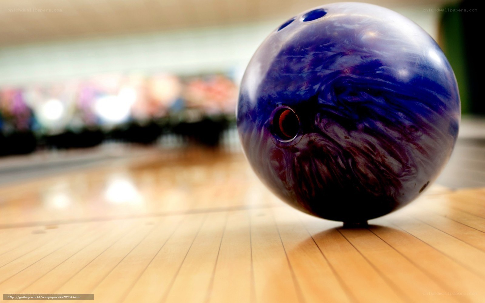Purple bowling ball on lane