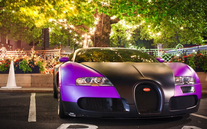 Purple Bugatti at night