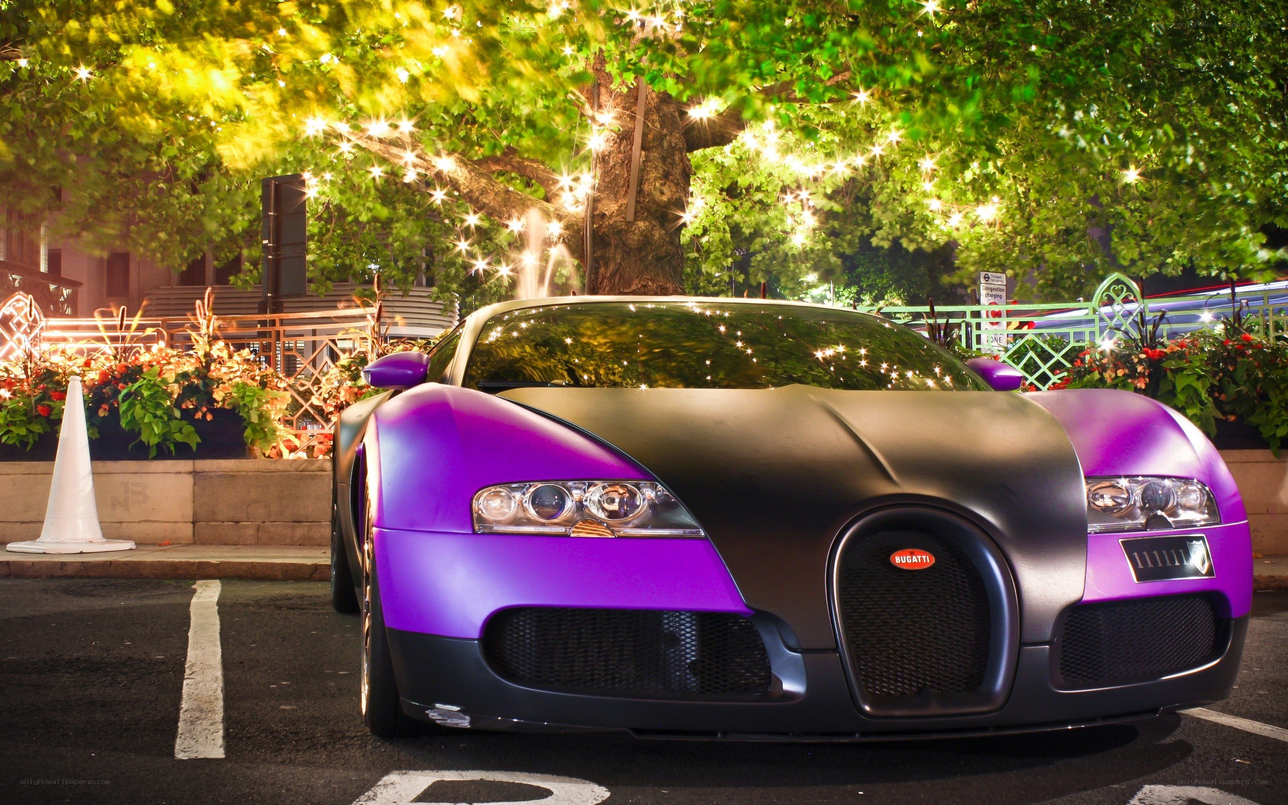Purple Bugatti at night