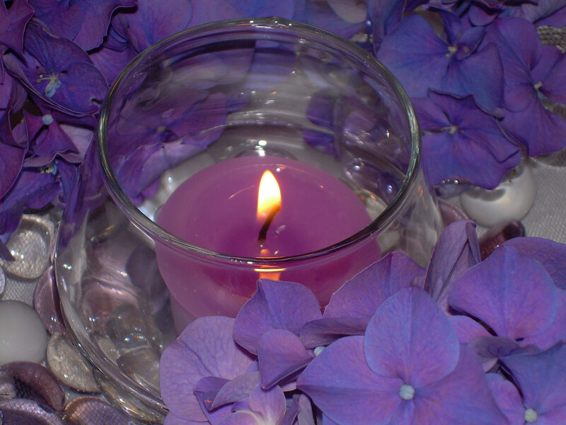 purple candle with hydrangeas
