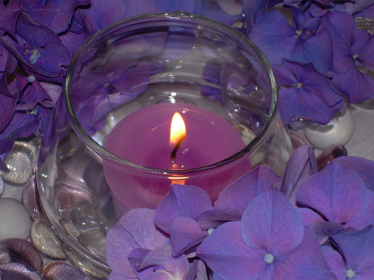 purple candle with hydrangeas