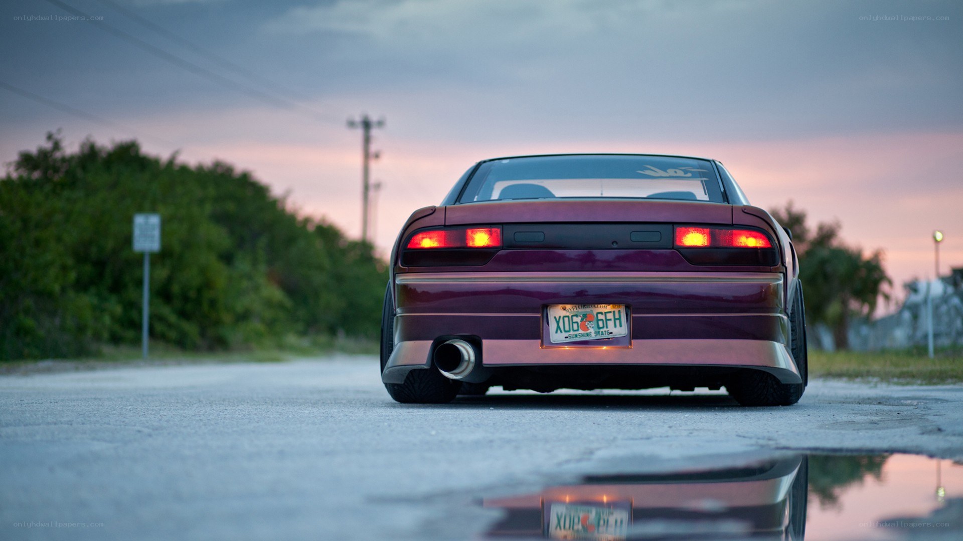 purple car at dusk on road