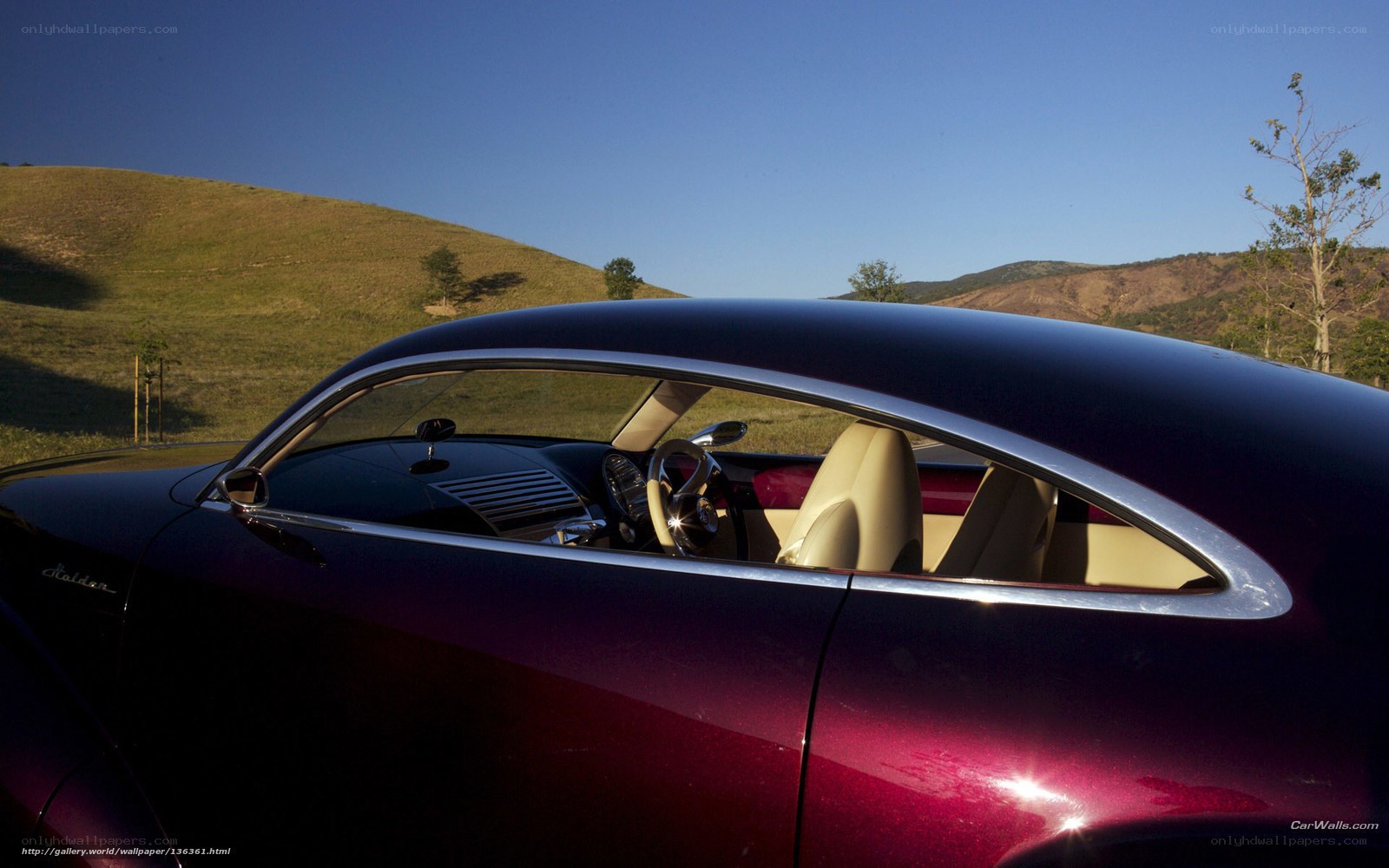 Purple car in a scenic landscape