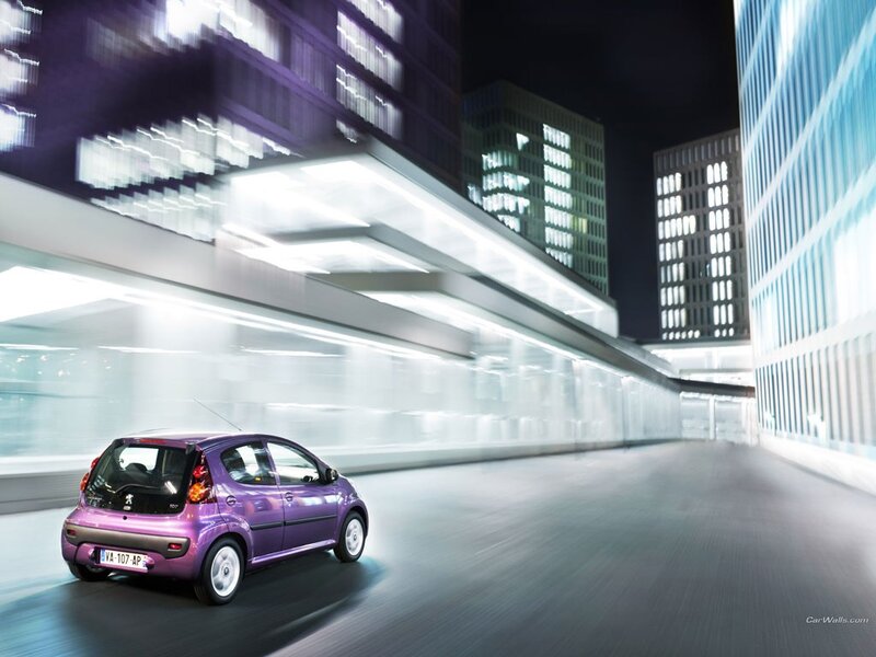 purple car in city at night