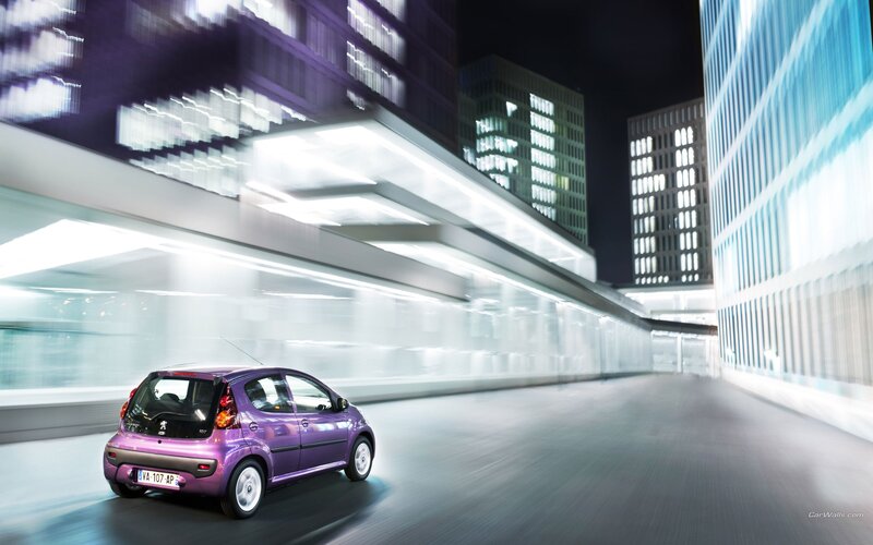 purple car in city at night