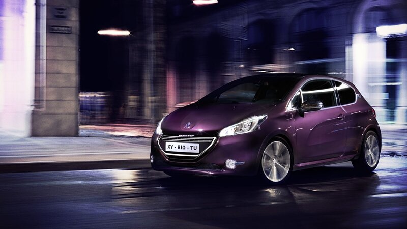 Purple car in city at night