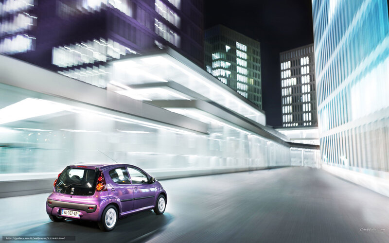 Purple car in city at night