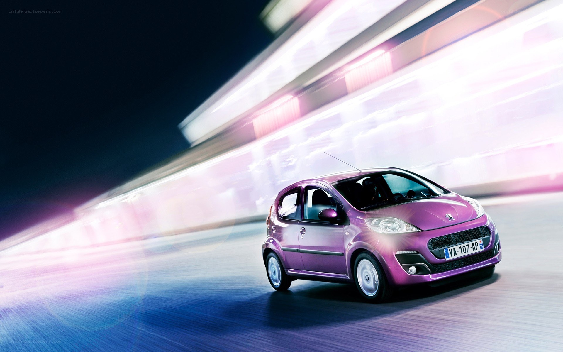 Purple car in motion at night