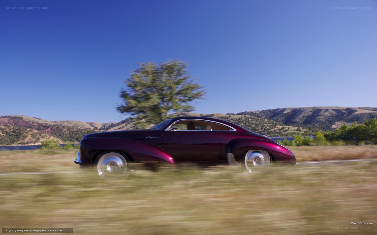 Purple car on a scenic road