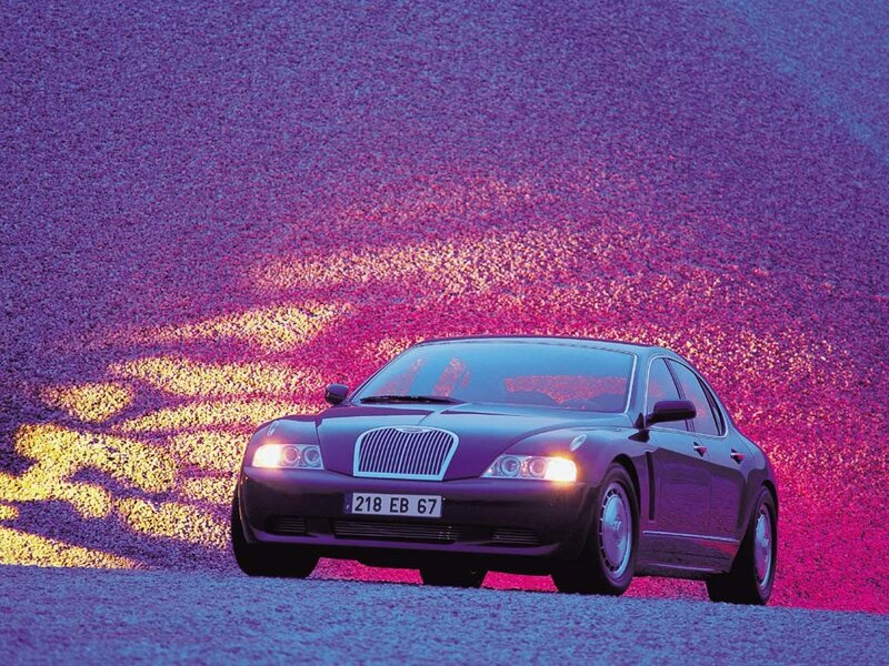 Purple car on gravel background