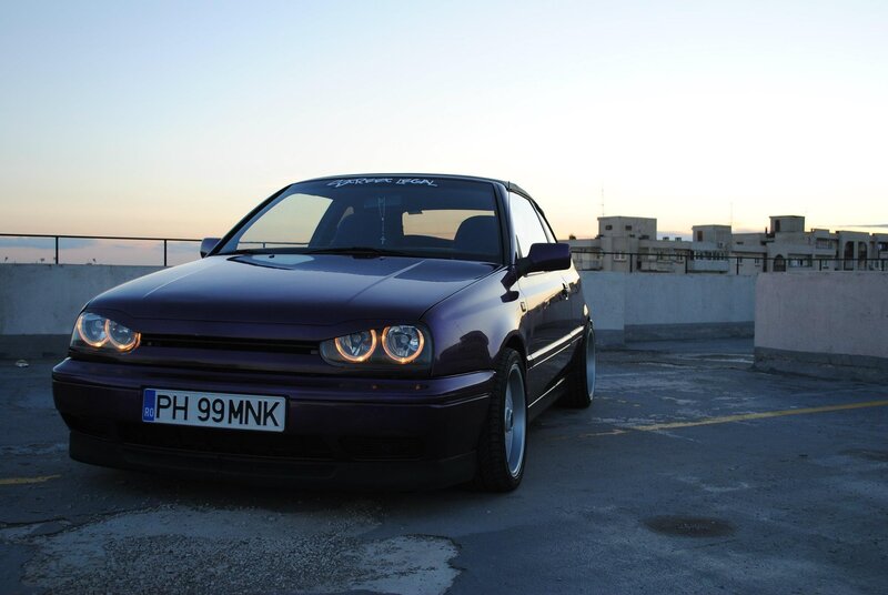 Purple car on rooftop at dusk
