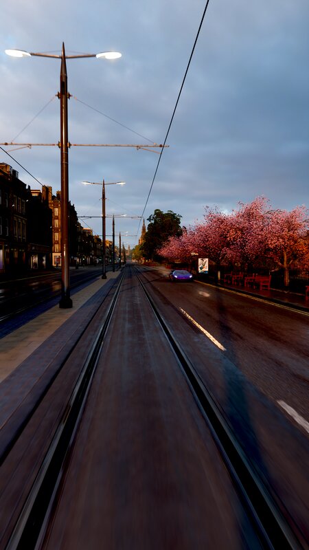 Purple Car on Tram Tracks