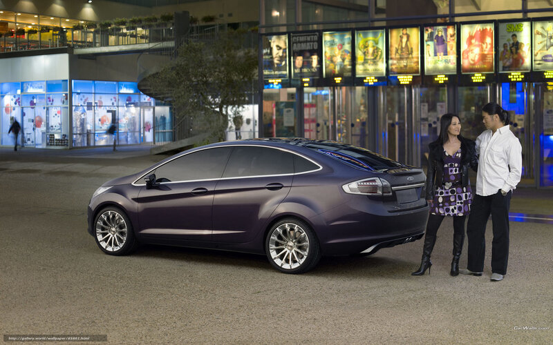 Purple car with couple at cinema