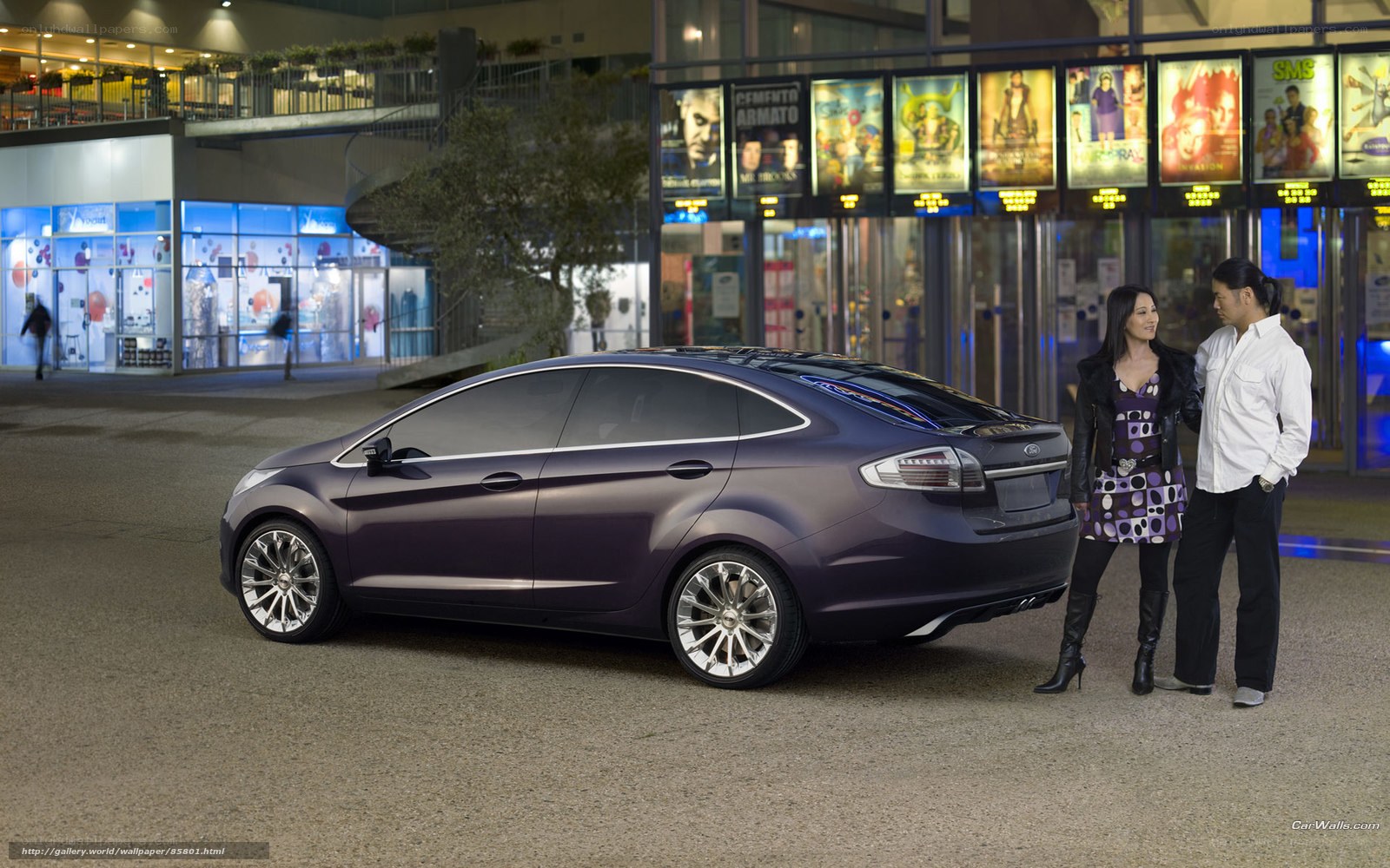 Purple car with couple at cinema