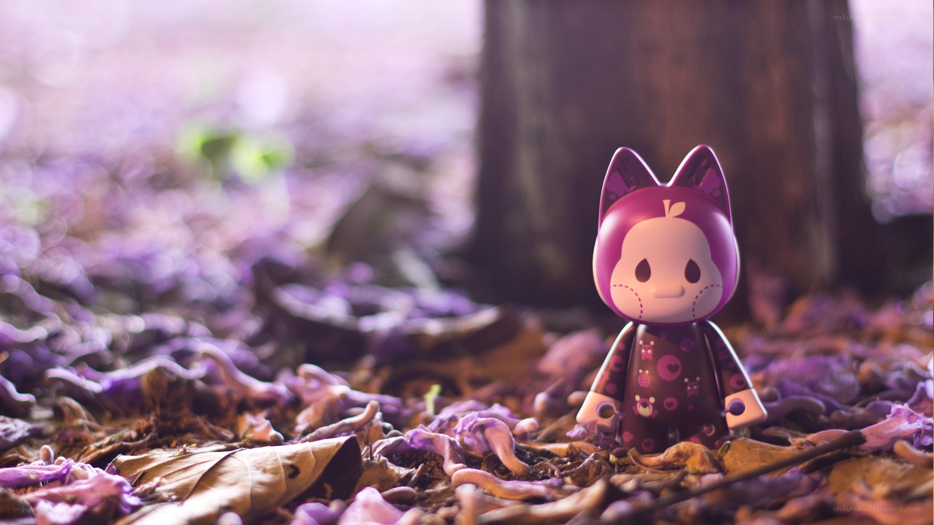 Purple cat figurine in forest