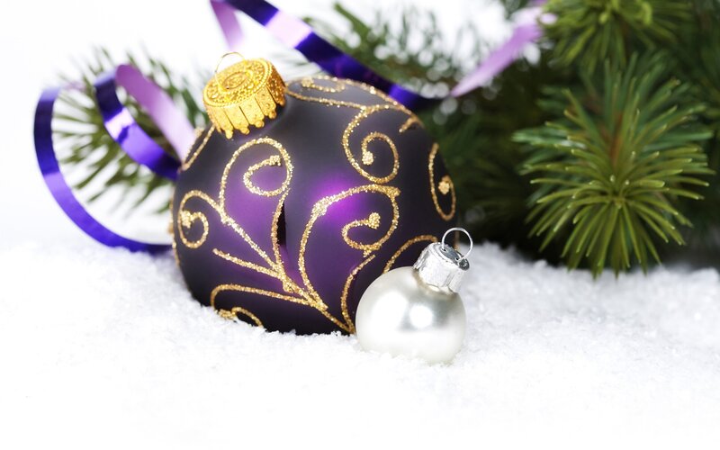 Purple Christmas ornament in snow
