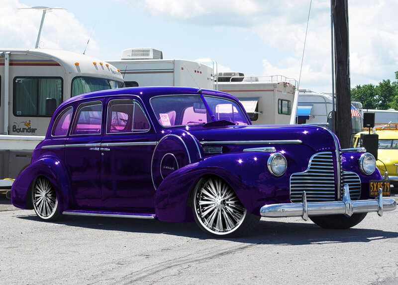 purple classic car at outdoor show