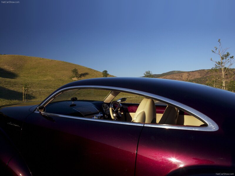 Purple classic car in a field