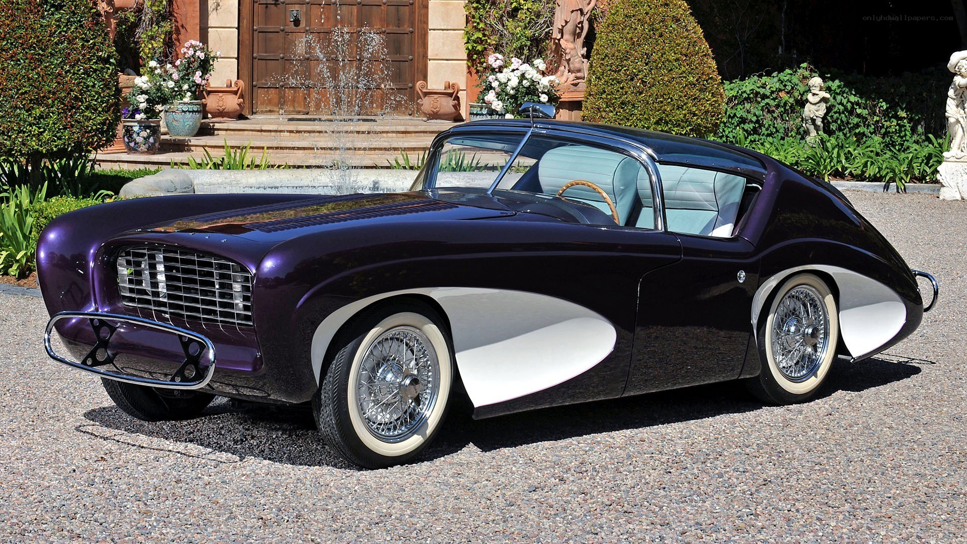 Purple classic car in garden