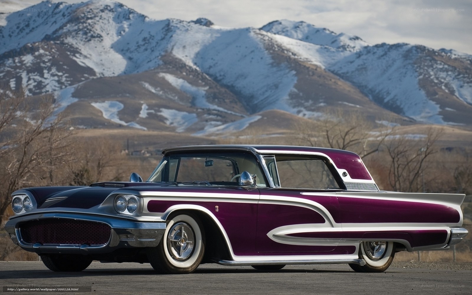 Purple classic car in mountains