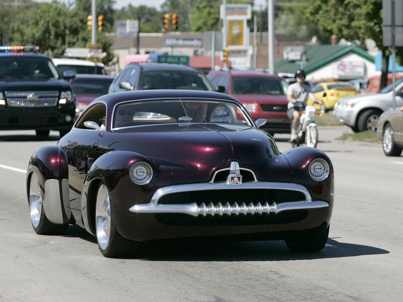 Purple classic car on city street