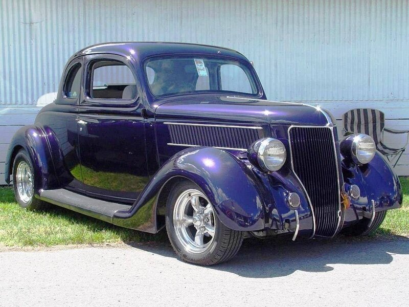 Purple classic car on display
