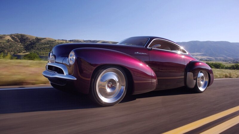 Purple classic car on road