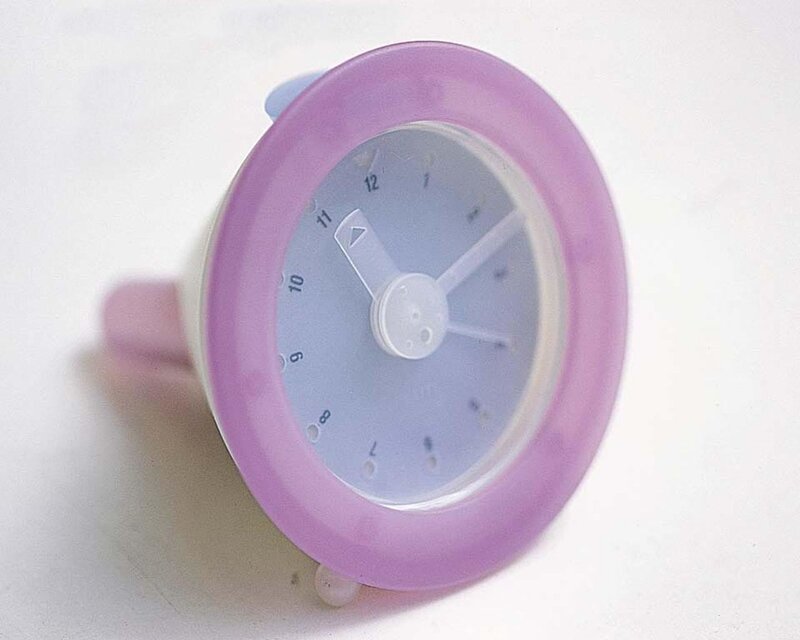 purple clock on white surface