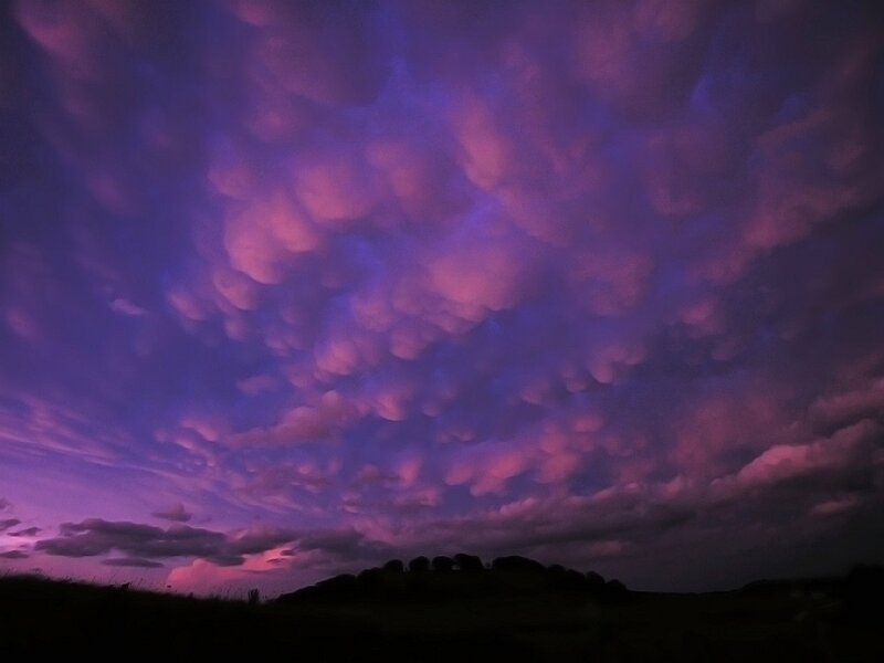 Purple Clouds over Hill