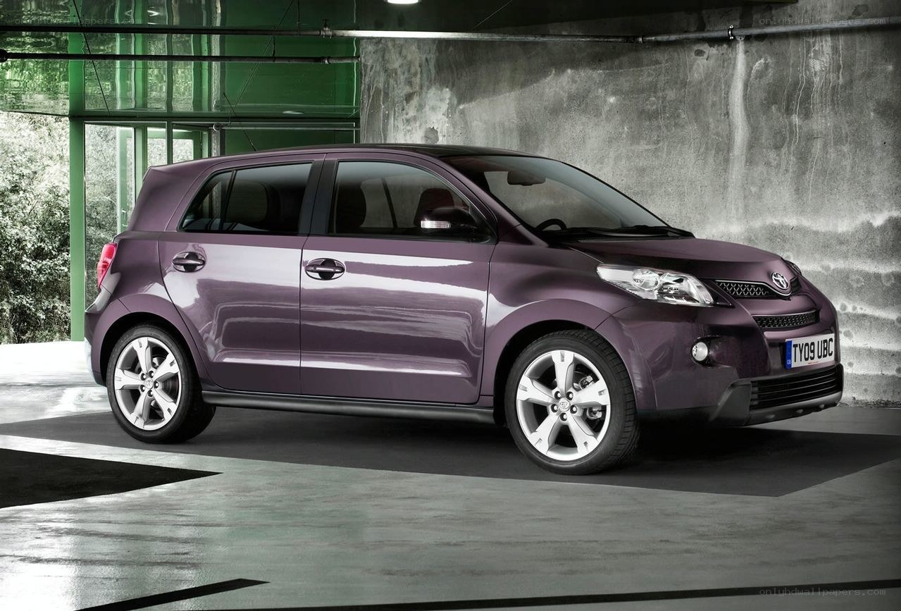 purple compact car in garage